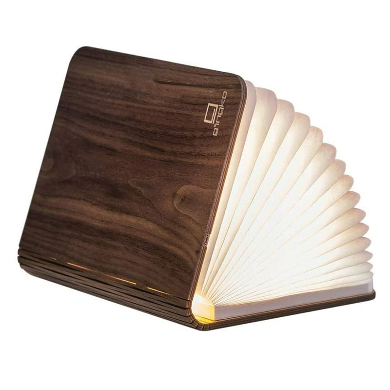 Wooden book-shaped lamp on a white background