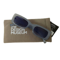 thick frame round sunglasses transparent grey colour with blue lens on its grey pouch in white background - front picture
