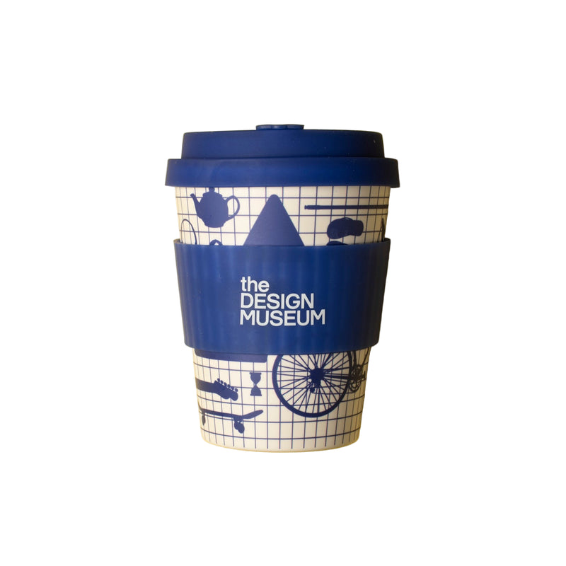 White and blue grid designed coffee cup with blue lid and design museum branding on a white background