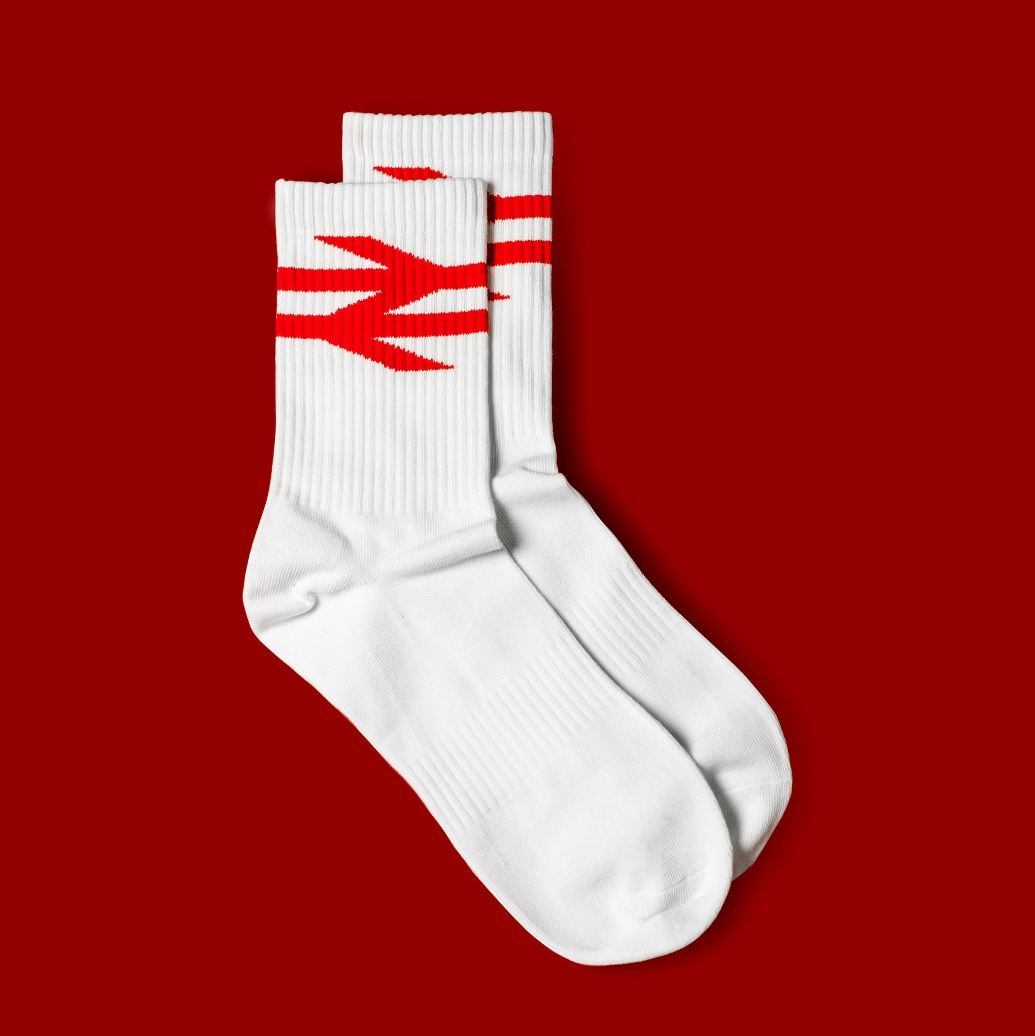 White socks with red network rail logo on a red background