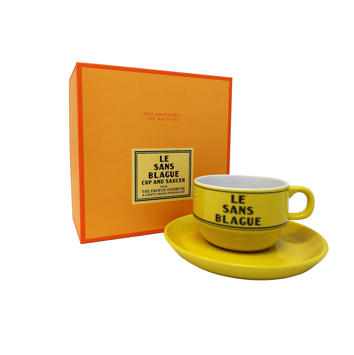Yellow cup and saucer with 'Le Sans Blague' text next to an orange box on a white background