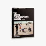 front cover of "The street photographer's manual book" b Thames & Hudson, book cover has a picture of kids taking pictures on what it looks like a sunny day in the pier by the seaside somewhere in the USA.