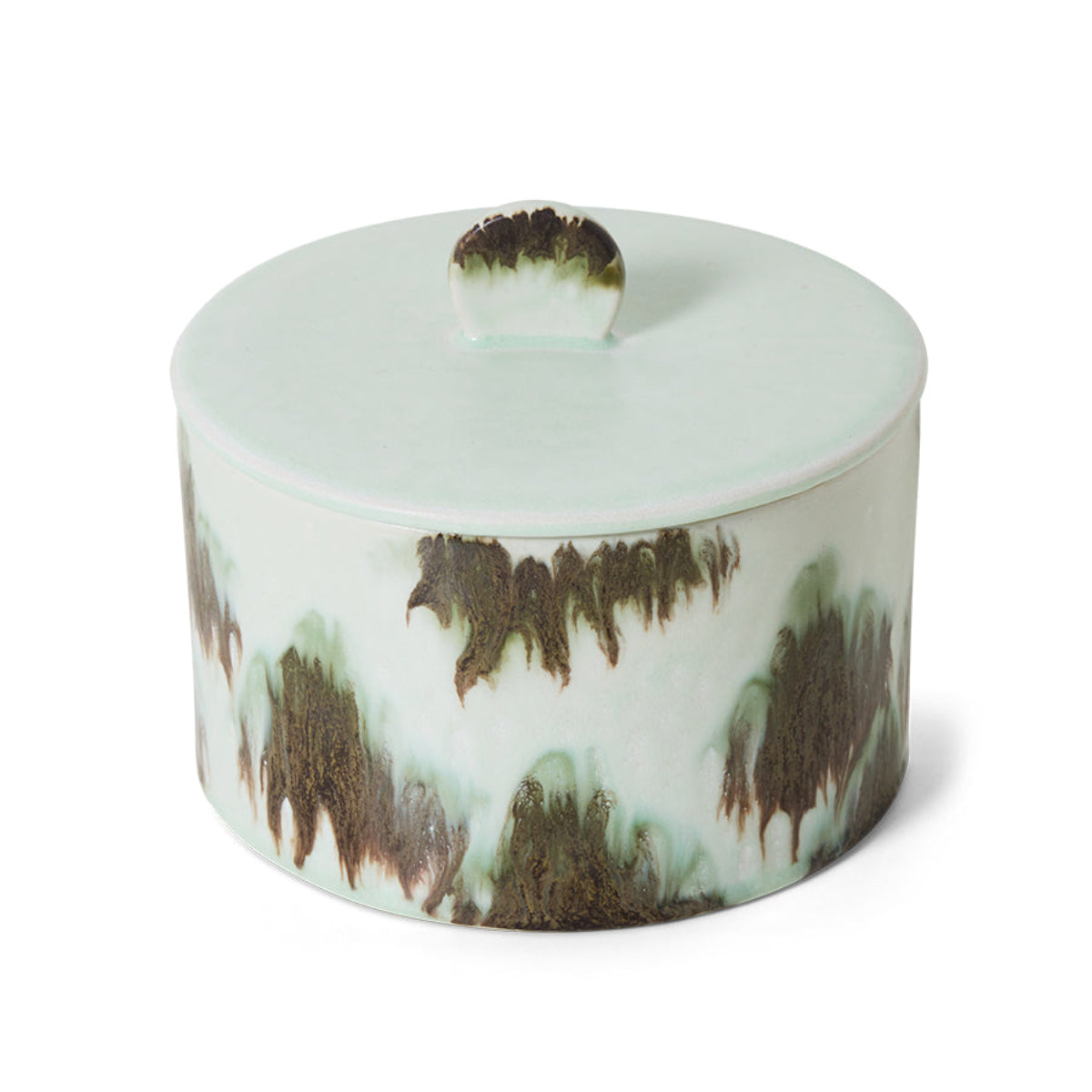 A green and black abstract ceramic storage jar on a white background