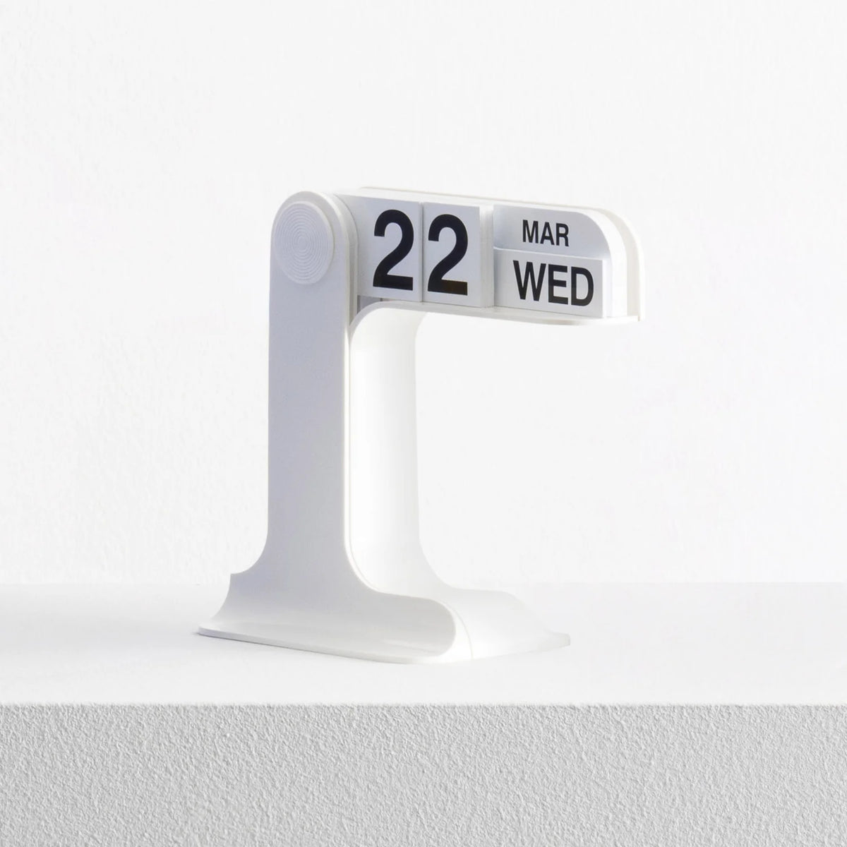 Calendar display showing date and day on a white background