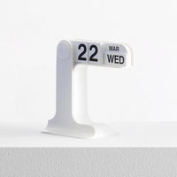 Calendar display showing date and day on a white background
