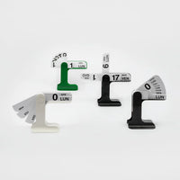 Four modern analog calendar date displays arranged on a clean white background. 