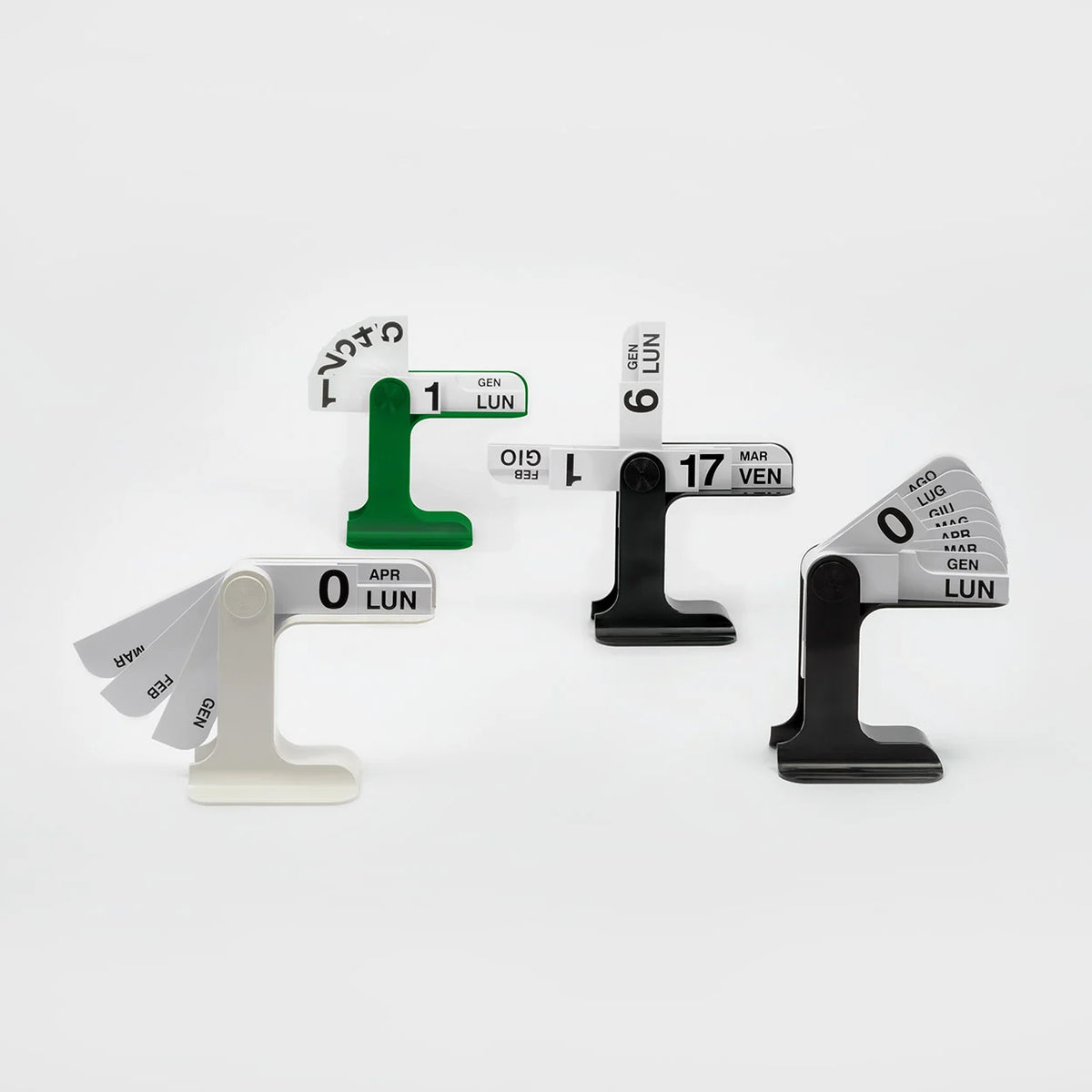 Four modern analog calendar date displays arranged on a clean white background. 
