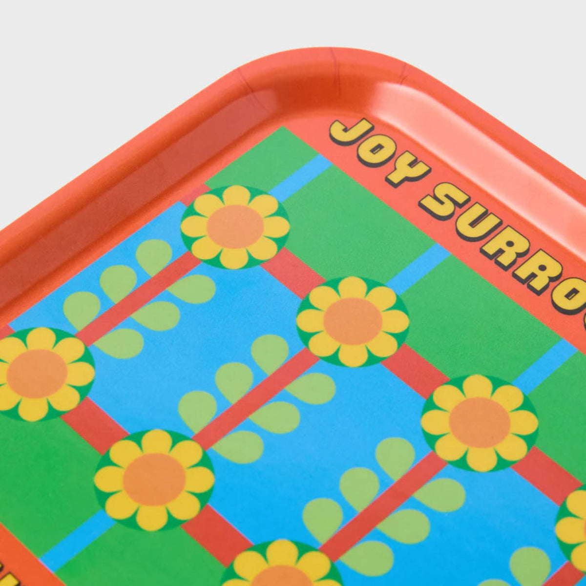 Colourful tray with floral pattern and text on a white background