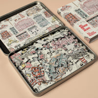 Puzzle pieces and packaging on a beige background