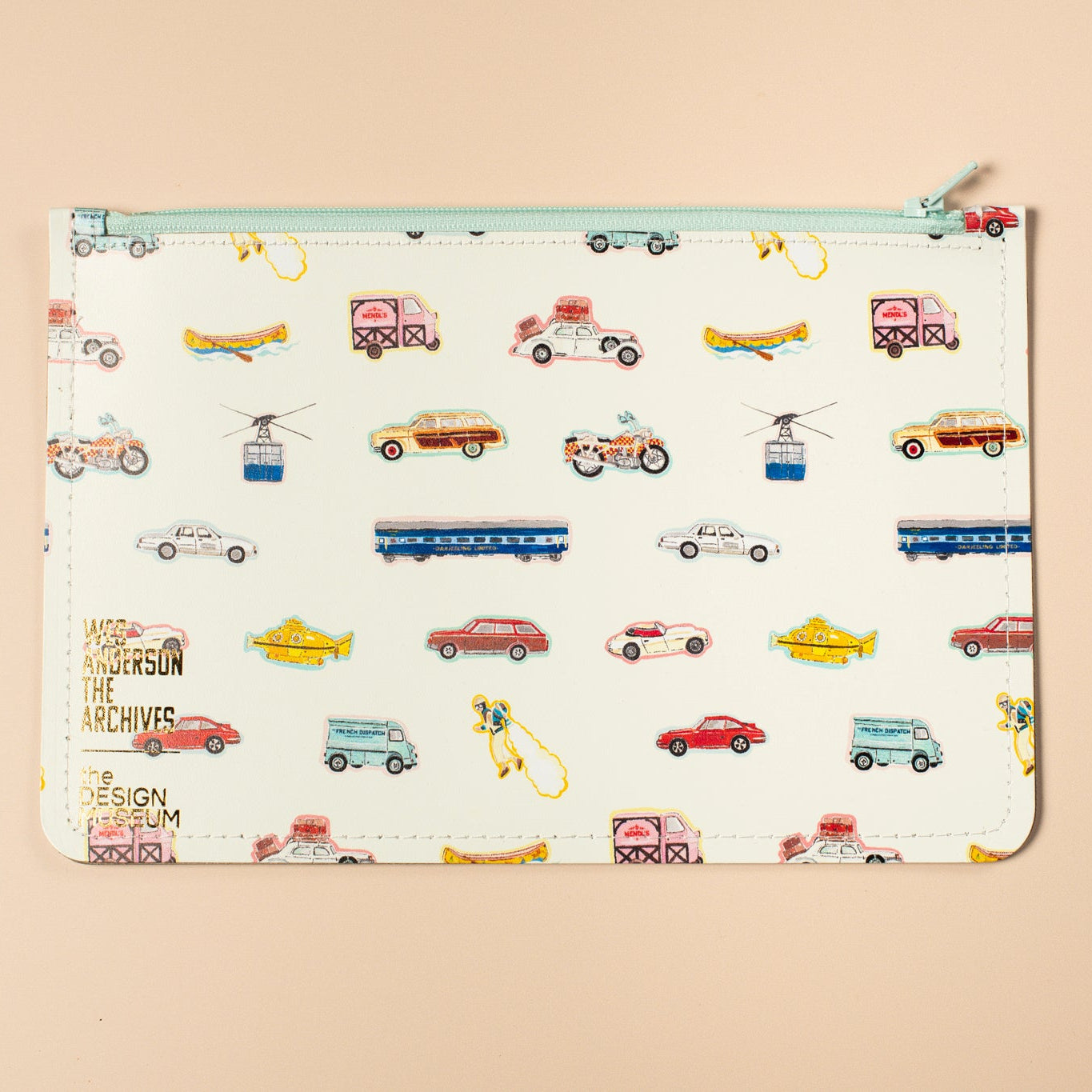 White leather pouch with vintage vehicle illustrtaions on a beige background