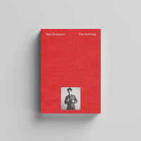 Red book titled 'Wes Anderson The Archives' with a small photo of a person on a gray background