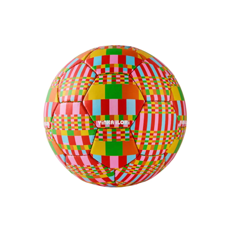 Colourful checkered soccer ball on a light gray background