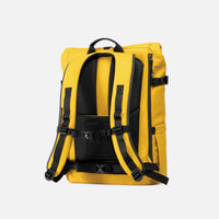 Yellow backpack with black straps on a light gray background