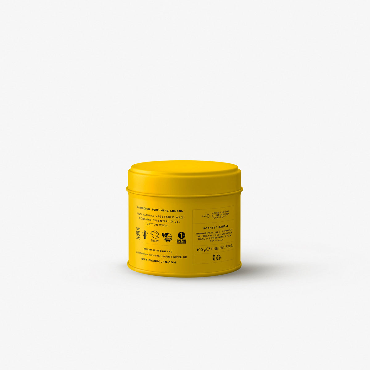 Yellow candle tin featuring bold black text