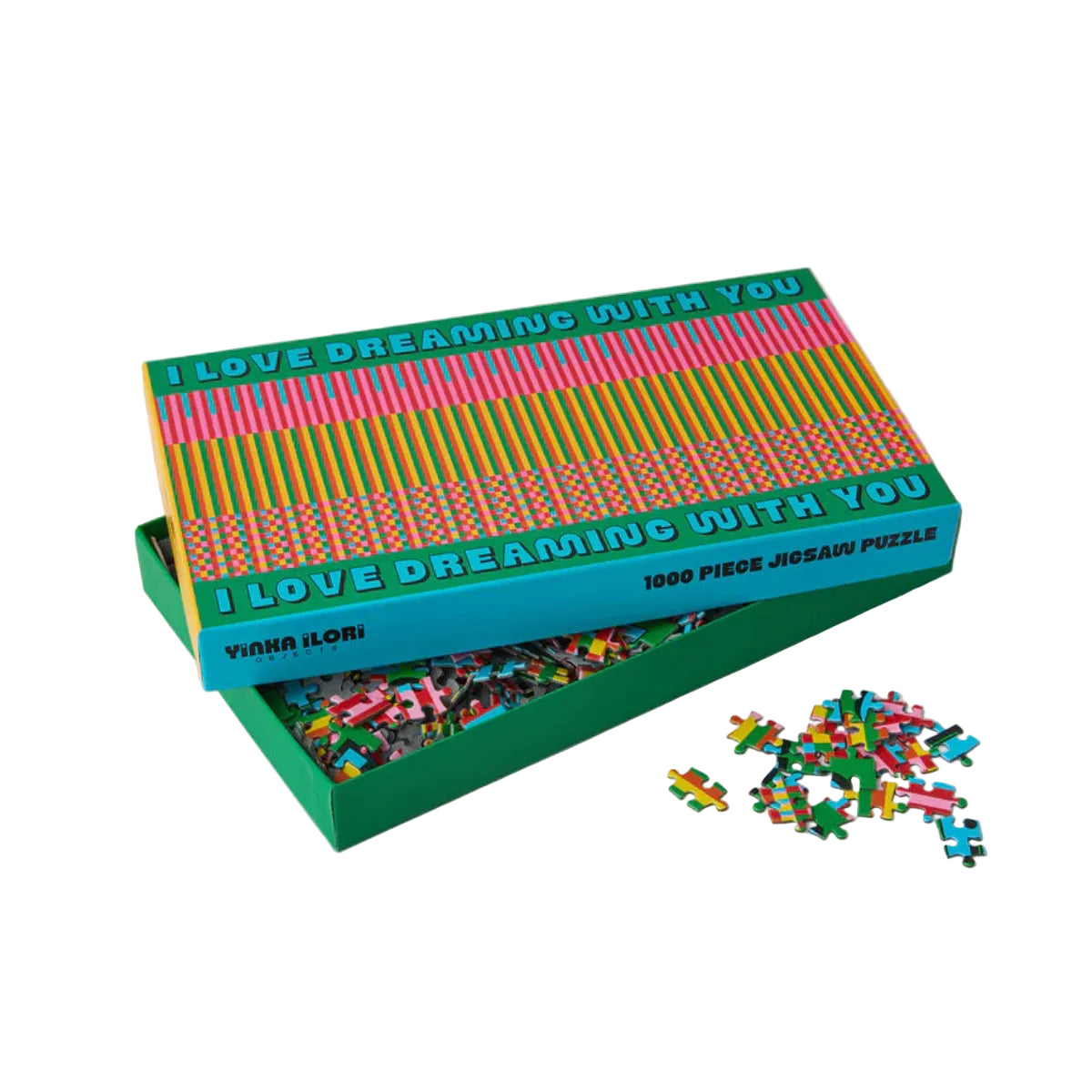 Jigsaw puzzle with colorful pieces and a decorative box on a white background