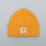 Moustard beanie with a skateboard logo on a white background