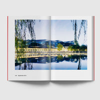 Open page featuring a building on a lake side