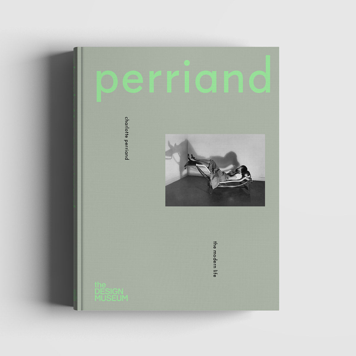 Sage green front cover of Charlotte Perriand: The Modern Life Exhibition Catalogue with light green text.