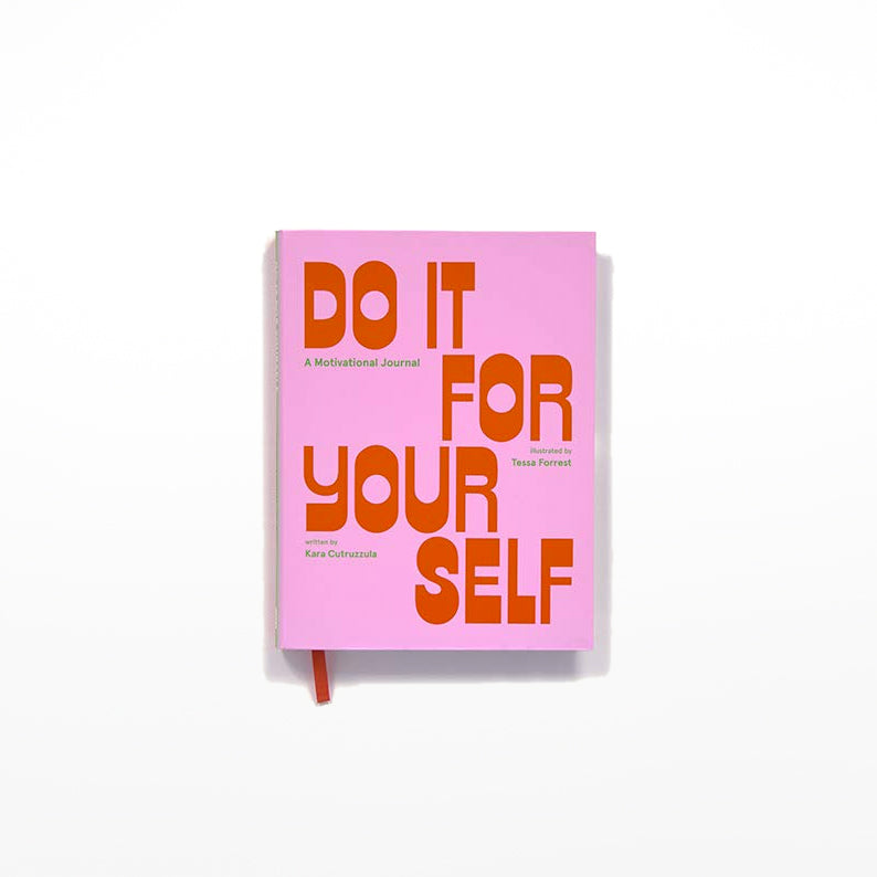 A pink journal with the title 'DO IT FOR YOURSELF' in bold orange letters on the cover.