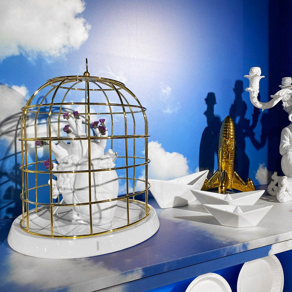 Gold bird cage with porcelain base
