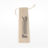 Brown fabric straw set bag with Design Museum logo on a white background