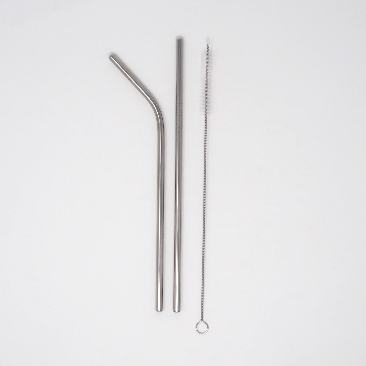 Stainless steel straws and cleaner on a white background