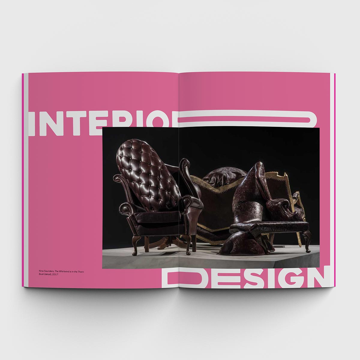 Pink inside pages of Surrealism catalogue with abstract image of chairs and white text
