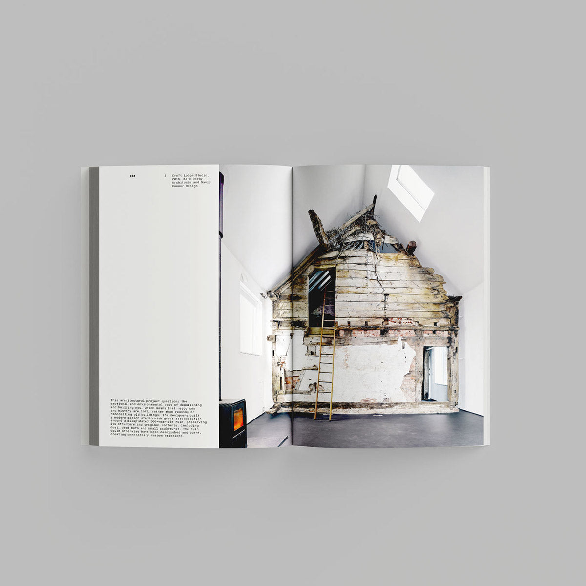 Inside page of Waste Age catalogue featuring wooden lodge inside a studio.